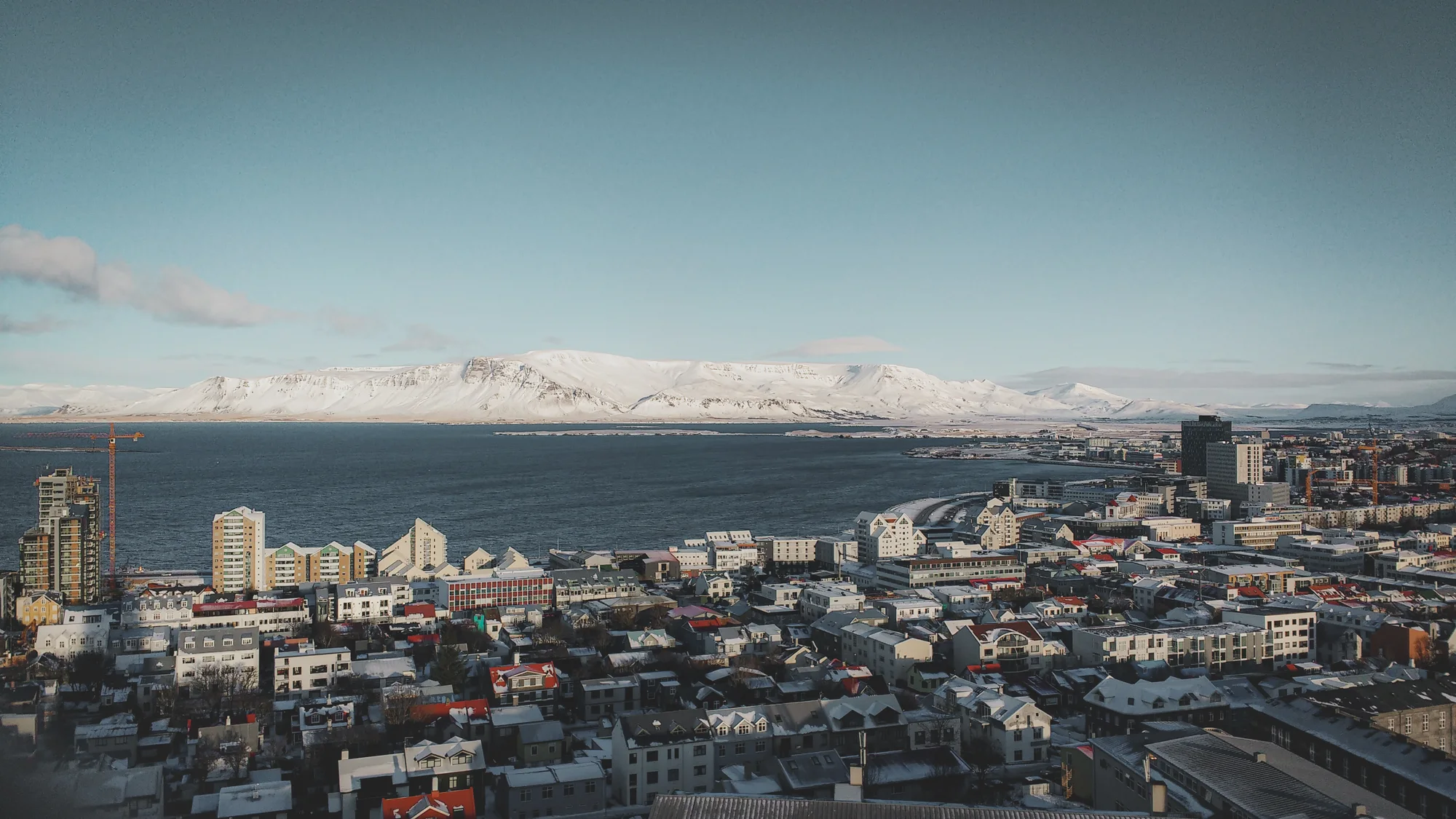 Reykjavík, the city, bay and mountains at dusk