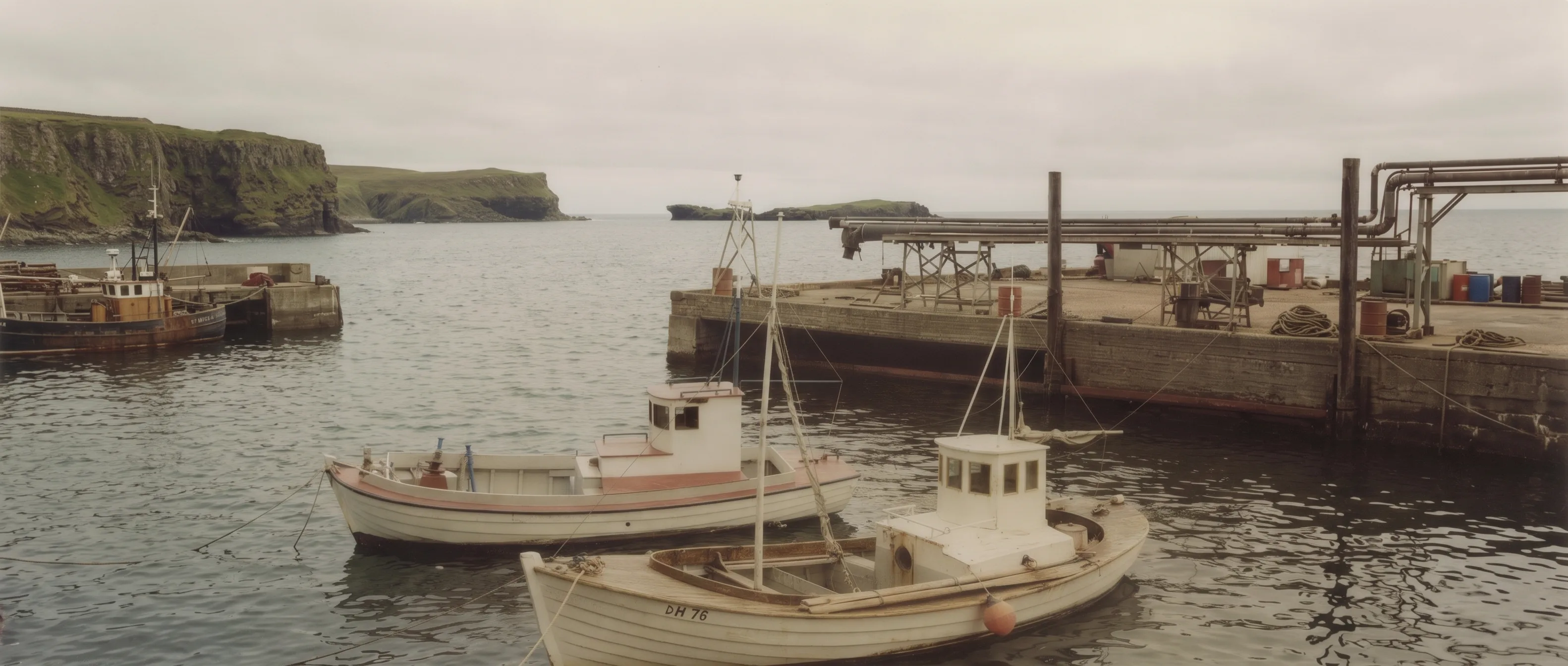 Fishing boats moored in an Icelandic harbor